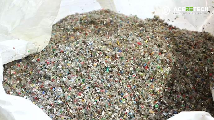 Shredded waste PET bottle material